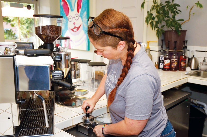 Thursday morning sees Brooke Simmons compacting fresh coffee into the portafilter before placing it into the espresso machine on a recent morning at The Chatham Rabbit. The coffee is tamped into the holder to make sure the water flows through it evenly, picking up the flavors it offers.