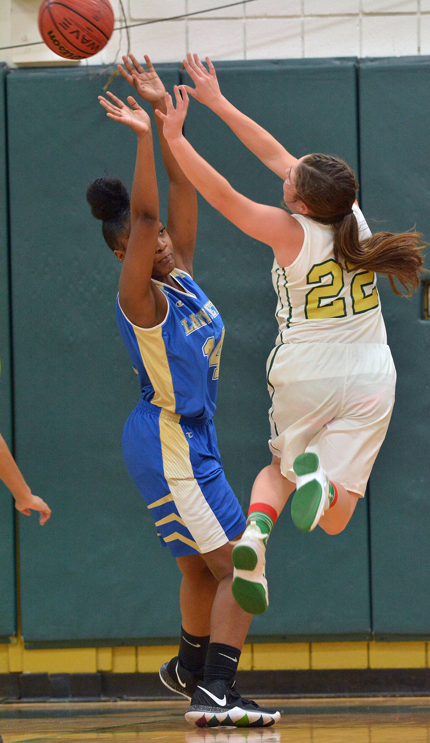 Eastern's Courtnee Cater, 22, pushes up a shot over Lady Jet J'mya Honeycut.