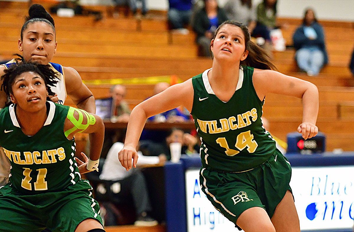 Eastern Randolph's Hallie Abrams heads in the lane for a rebound as teammate Aniyah King boxes out.
