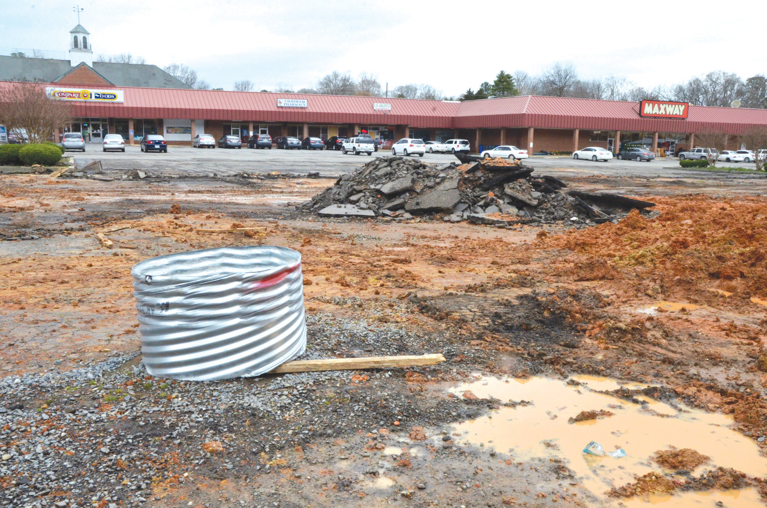 Flooding has been a continual issue in the Maxway parking lot for decades. New culverts are being installed and the parking lot will be repaved at the shopping center owner's expense.