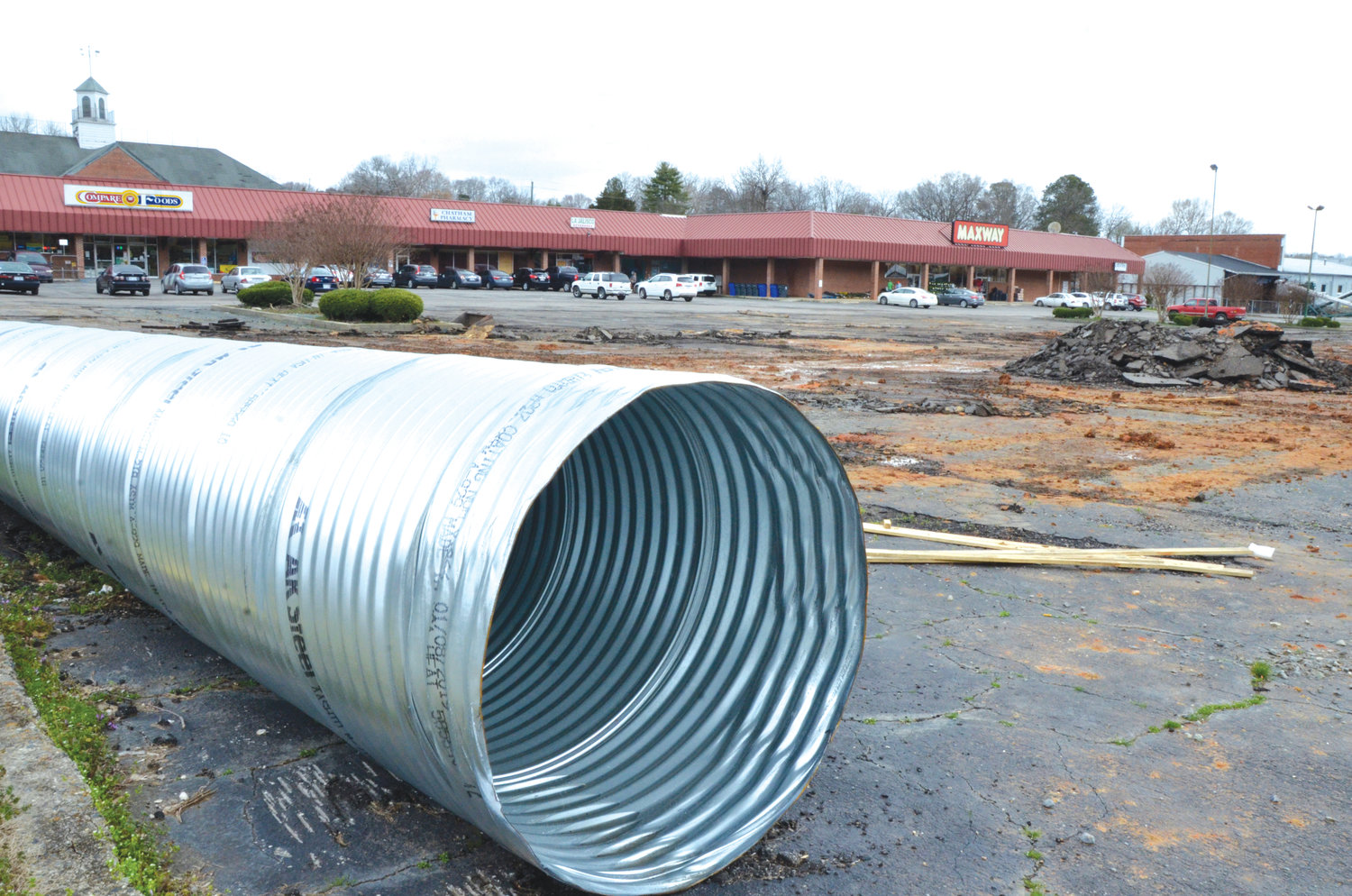 A steel tube will be installed, replacing a worn-out culvert, to better manage stormwater flow at the Maxway parking lot. Stormwater in the Loves Creek Watershed has been flooding the lot — and nearby businesses — for decades.