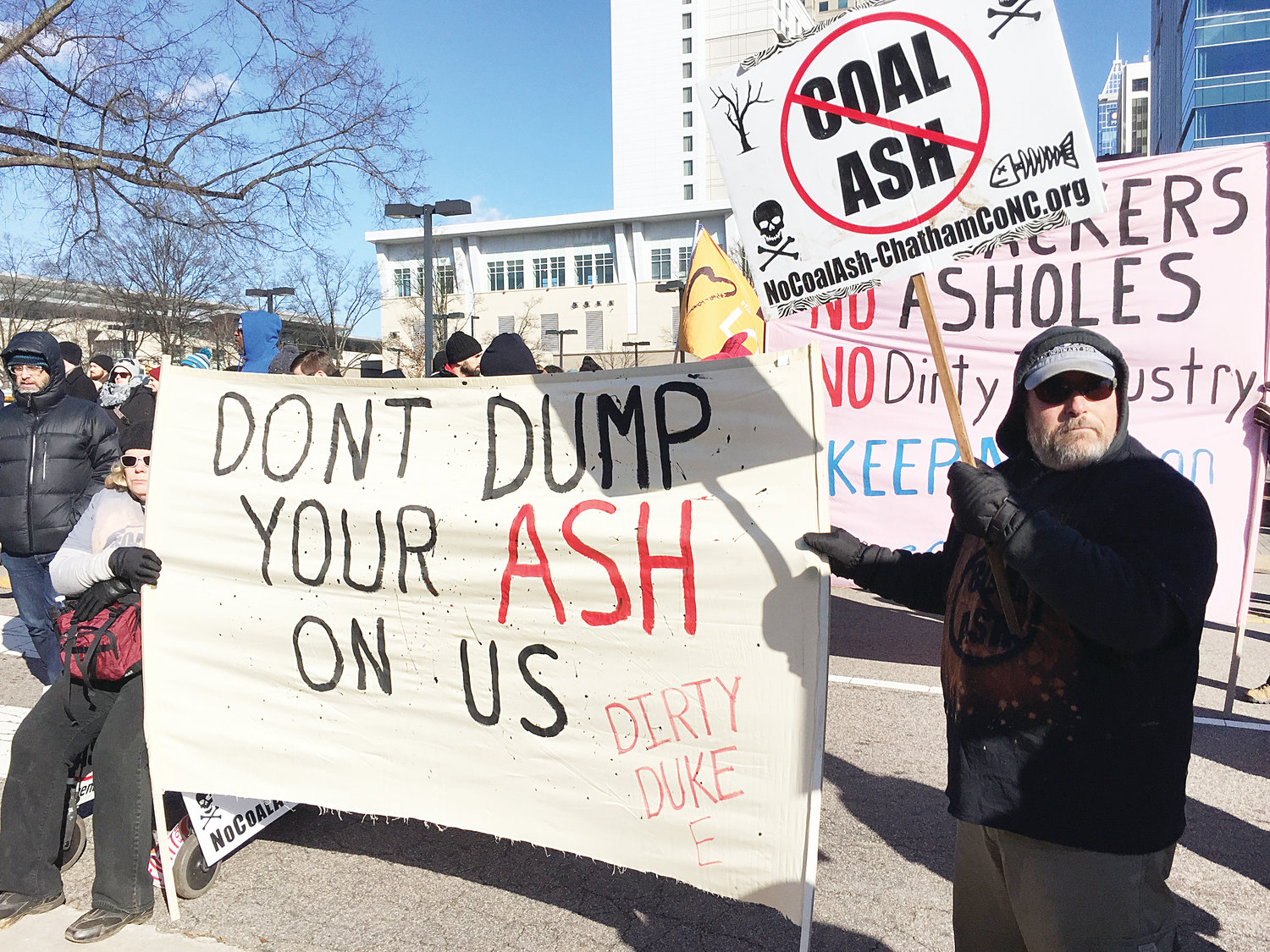 Opposition to the coal ash site at Brickhaven filed lawsuits to prevent the operation. Here, a group of activists protest coal ash at the annual HKonJ event in Raleigh.