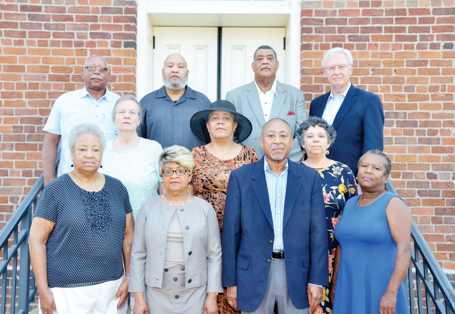 Members of Chatham County's two NAACP chapters who are involved in an effort to memorialize the six victims of racial terror lynching in Chatham stand on the steps of the PIttsboro courthouse. Front row, from left: Armentha Davis, Mary Harris, Larry Brooks and Mary Nettles. Middle row, from left: Vickie Shea, Cledia Holland and Linda Batley. Back row, from left: Glenn Fox, Wayne Holland, Carl Thompson and Bob Pearson. Pearson, a retired attorney and diplomat who lives in Fearrington Village, was responsible for getting the effort started.
