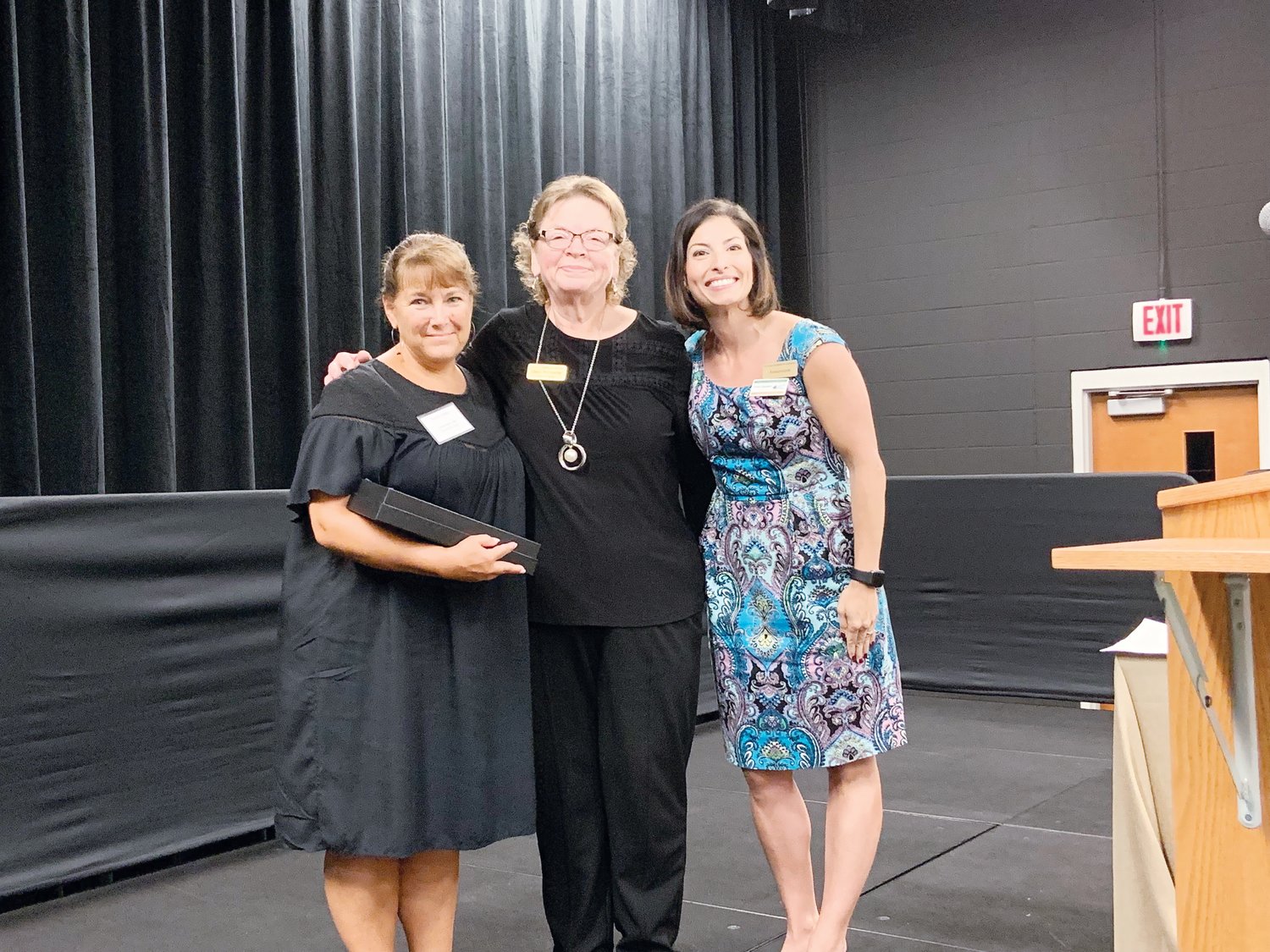 Ronda Stubbs, left, marketing director for Cambridge Hills Assisted Living, receives the award for Chamber Ambassador of the Year, presented by Cindy Poindexter of the Chatham Chamber, middle, and Erica Sanders, at the Chatham Chamber of Commerce’s Annual Meeting last week in Pittsboro.