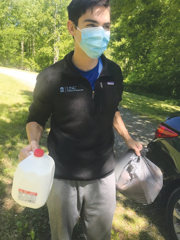 Luke Ford, a fourth-year medical student at UNC-Chapel Hill shown here, is leading a group of Carolina students doing service projects for seniors in Chatham County who are mostly shut-in by the COVID-19 pandemic.