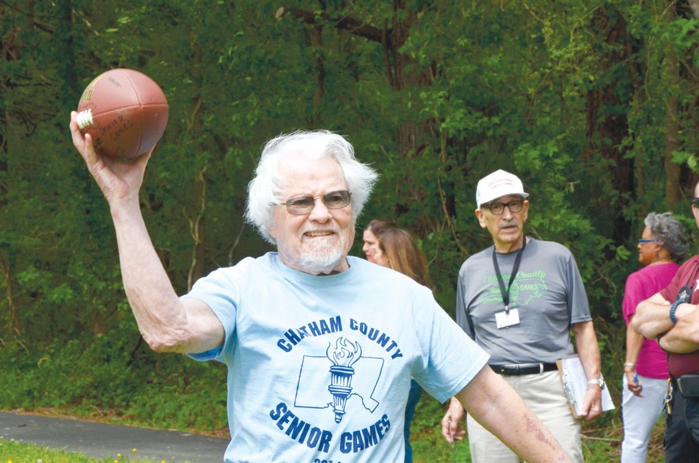 In this file photo from 2019, John Combest attempts a perfect spiral during the football toss competition at the Western Chatham Senior Center while in the Chatham County Senior Games.