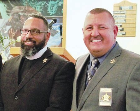 Rev. Corey Little (left), Pastor of Mitchell's Chapel AME Zion Church in Pittsboro participated in the forum on police reform with law enforcement including Chatham County Sheriff Mike Roberson (right). This photo was taken prior to COVID-19 at Rev. Little's Church.