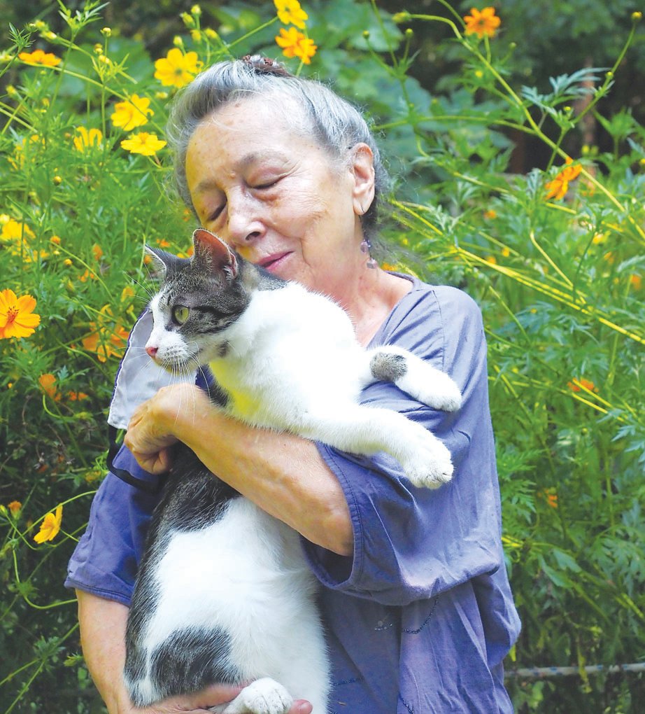 Siglinda Scarpa, founder of the Goathouse Refuge in Chatham County, has spent a lifetime creating art and sharing love with any animal she meets. Story, photos on page B4.