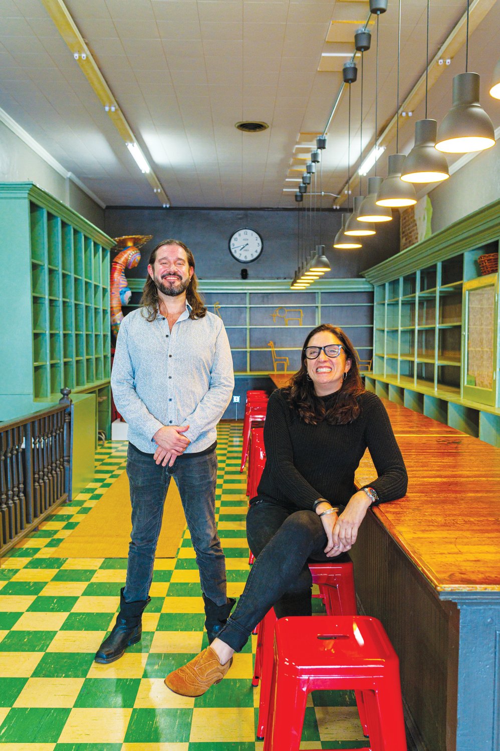 Michael Feezor of the N.C. Arts Incubator and Lisa Fedele, owner of The Alliance, sit in the program-center half of the building where students can access high-speed internet and confer with teachers in-person.