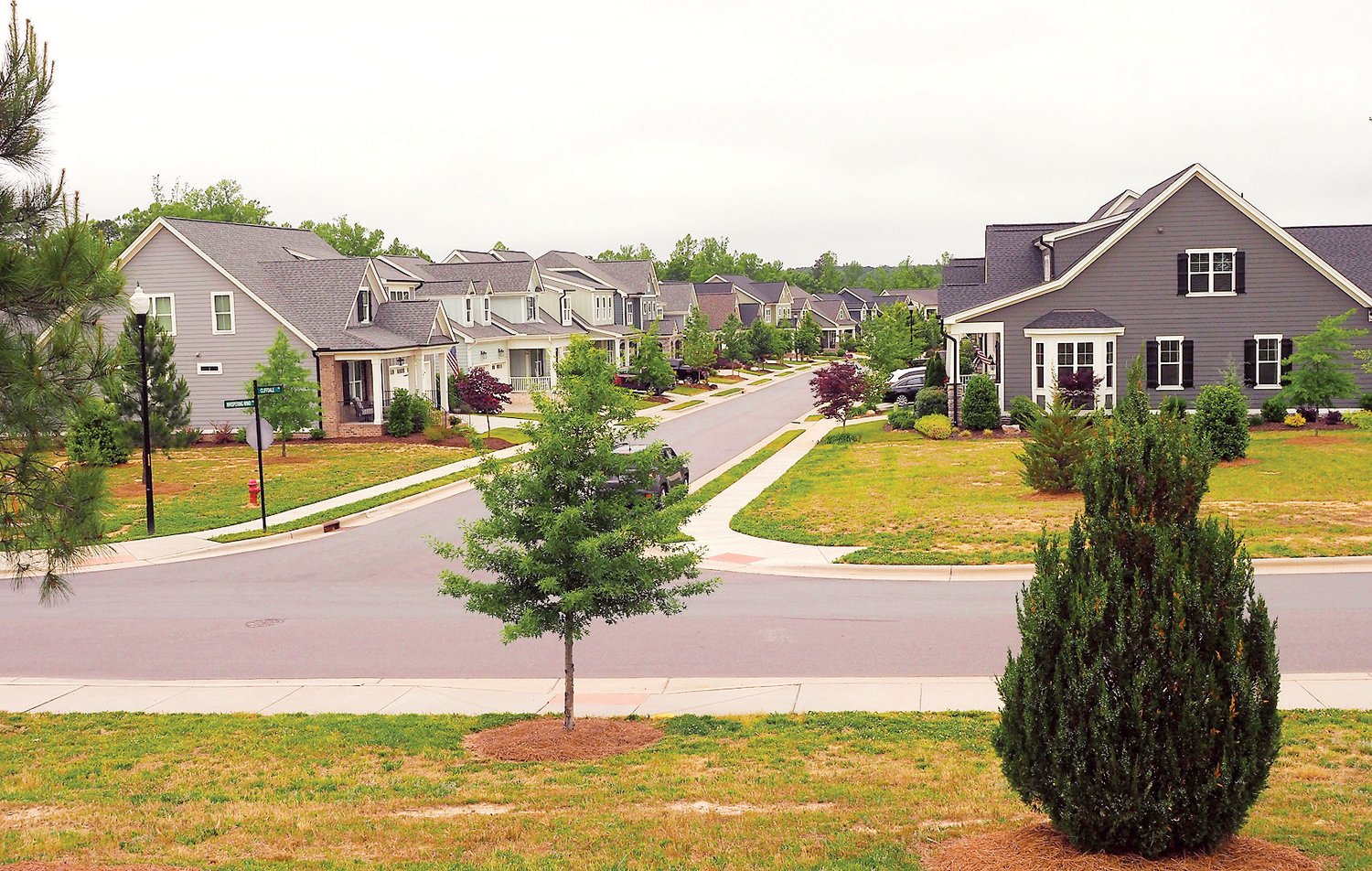 Homes at the intersection of Whispering Wind Drive and Cliffdale Road sit directly across from the neighborhood's privately operated wastewater treatment plant.
