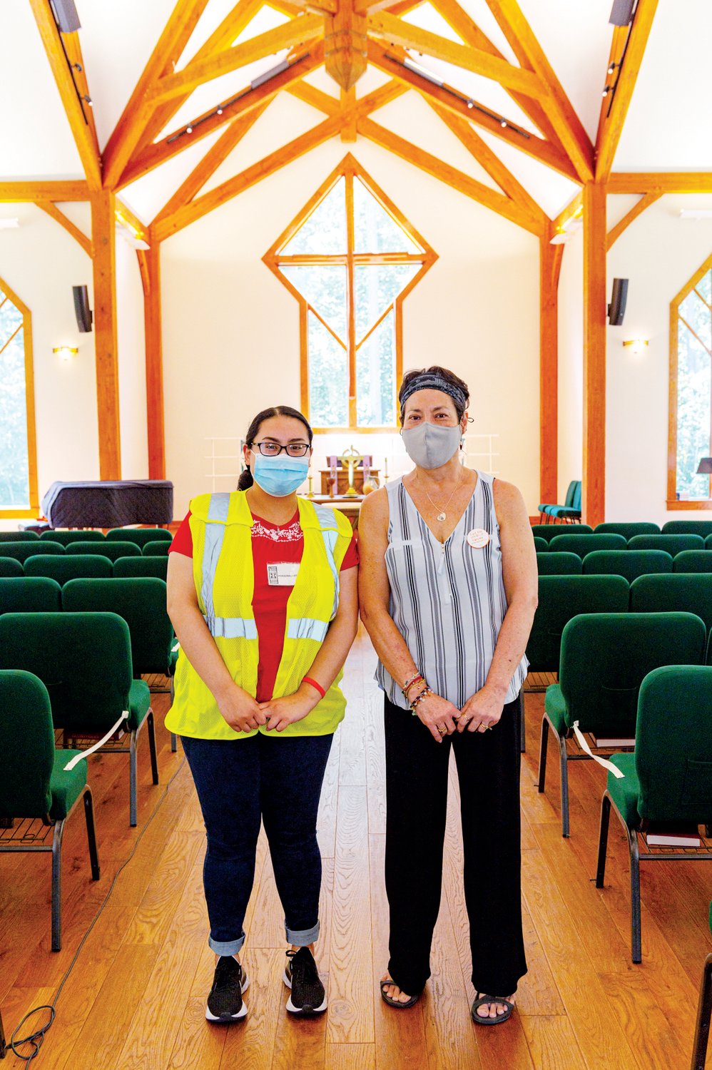 Noemi Mora (left) and Nana Morelli spent the day volunteering at Chapel in the Pines’ Sunday vaccination clinic. Mora works with the Hispanic Liaison while Morelli works with Chapel in the Pines.