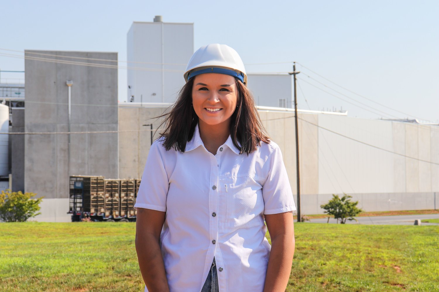 Sasha Duncan, shown here in front of Mountaire Farms’ Siler
City plant, is Mountaire’s new Siler City community relations
manager. She began her new role in early June.
