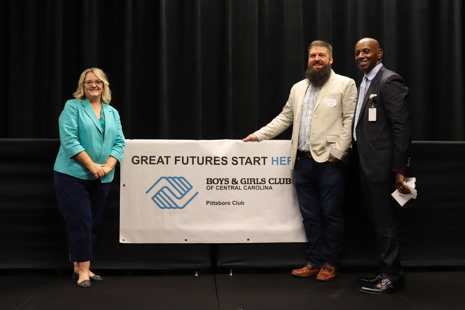 Dr. Amanda Hartness of Chatham County Schools (from left), Pittsboro Commissioner Kyle Shipp and Dr. Anthony Jackson, superintendent of Chatham County Schools, pose after last Wednesday’s fundraising breakfast for the Boys & Girls Club of Pittsboro. Shipp helped spearhead efforts to start the club; Jackson served as the event’s keynote speaker.