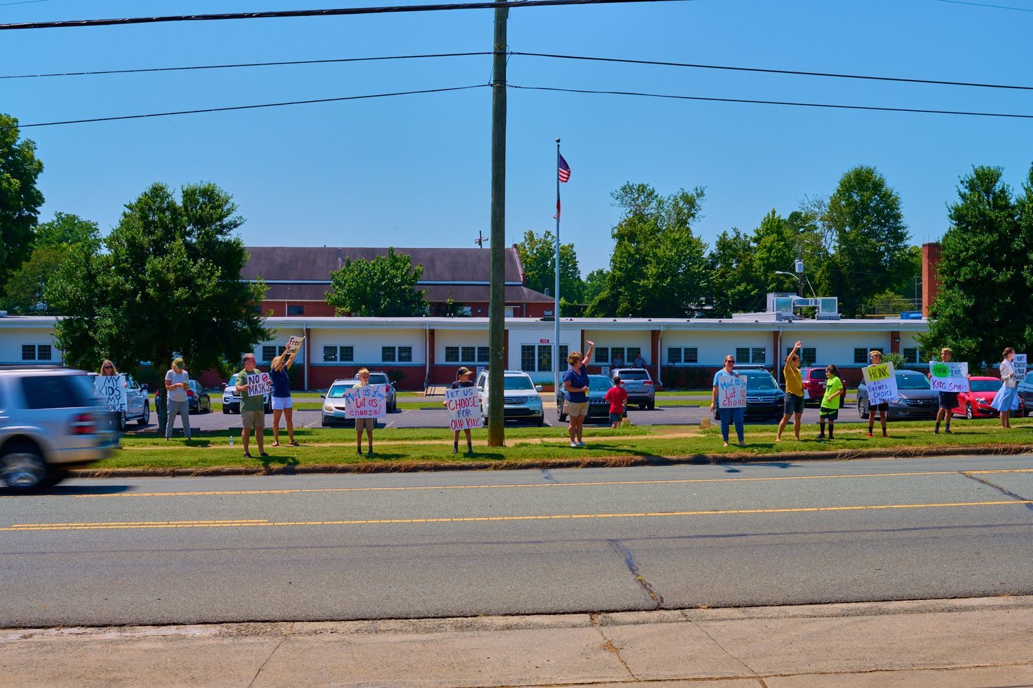 A small protest outside of the Chatham County Schools Board of Education meeting in August, at which the board voted to mandate universal indoor masking.