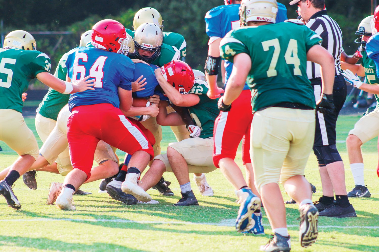 A swarm of Northwood defenders swallows a Southern Alamance ball carrier during a scrimmage at the Jack Shaner Jamboree, hosted by the Chargers, last Friday.