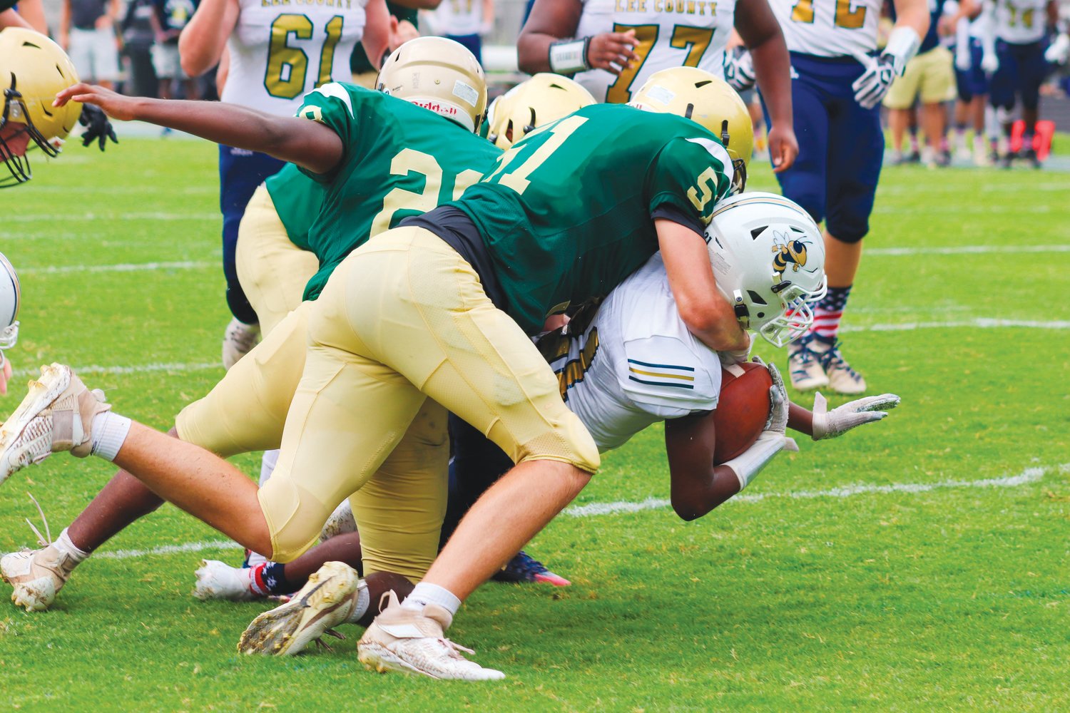 Northwood's Pierce Cook (51) tackles a Lee County ball carrier in the Chargers' season-opening loss to the Yellow Jackets, 62-0, last Saturday in Pittsboro.