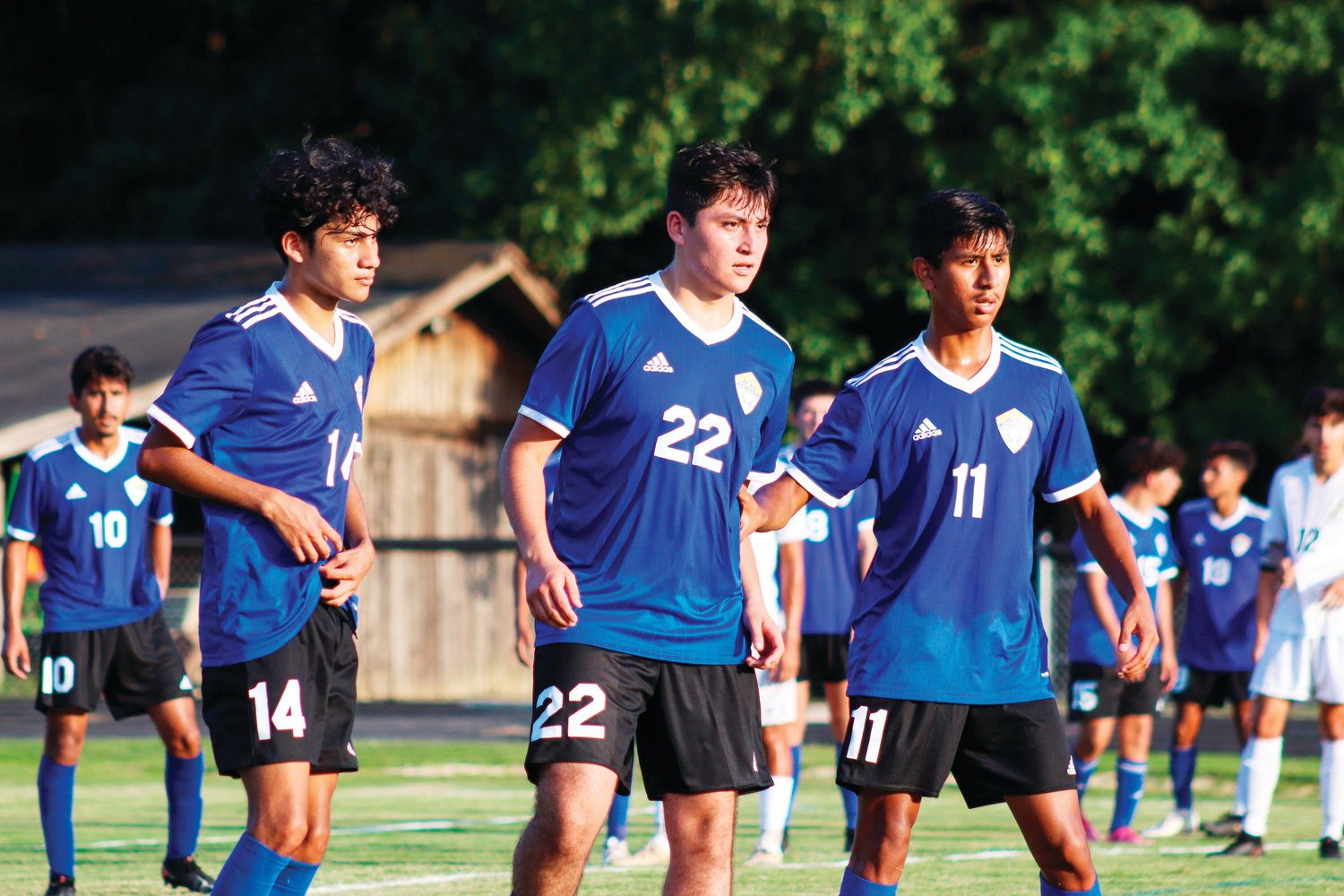 Jordan-Matthews players (from left to right: Brian Hernandez (10), Anthony Rodriguez, Irvin Campos, Armando Rocha (11)) prepare their defense in the Jets' 4-1 season-opening win over the Chargers last Thursday in Siler City.