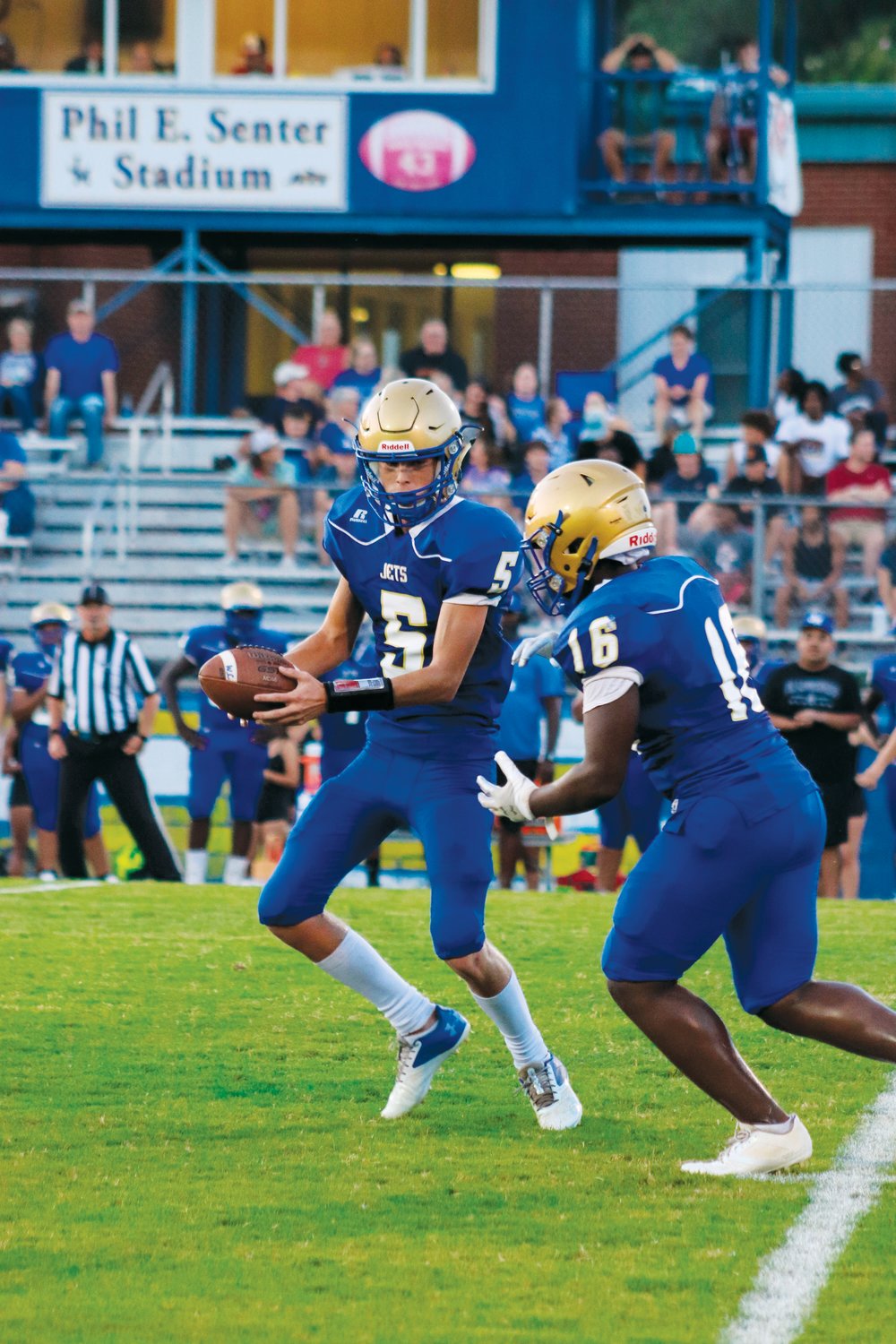 Jordan-Matthews sophomore quarterback Kelton Fuquay (5) hands the ball off to senior running back Rayshawn Alston during the Jets' 72-0 loss to Northwood last Friday. Alston was the Jets' leading rusher on the night with 12 yards on 10 carries.
