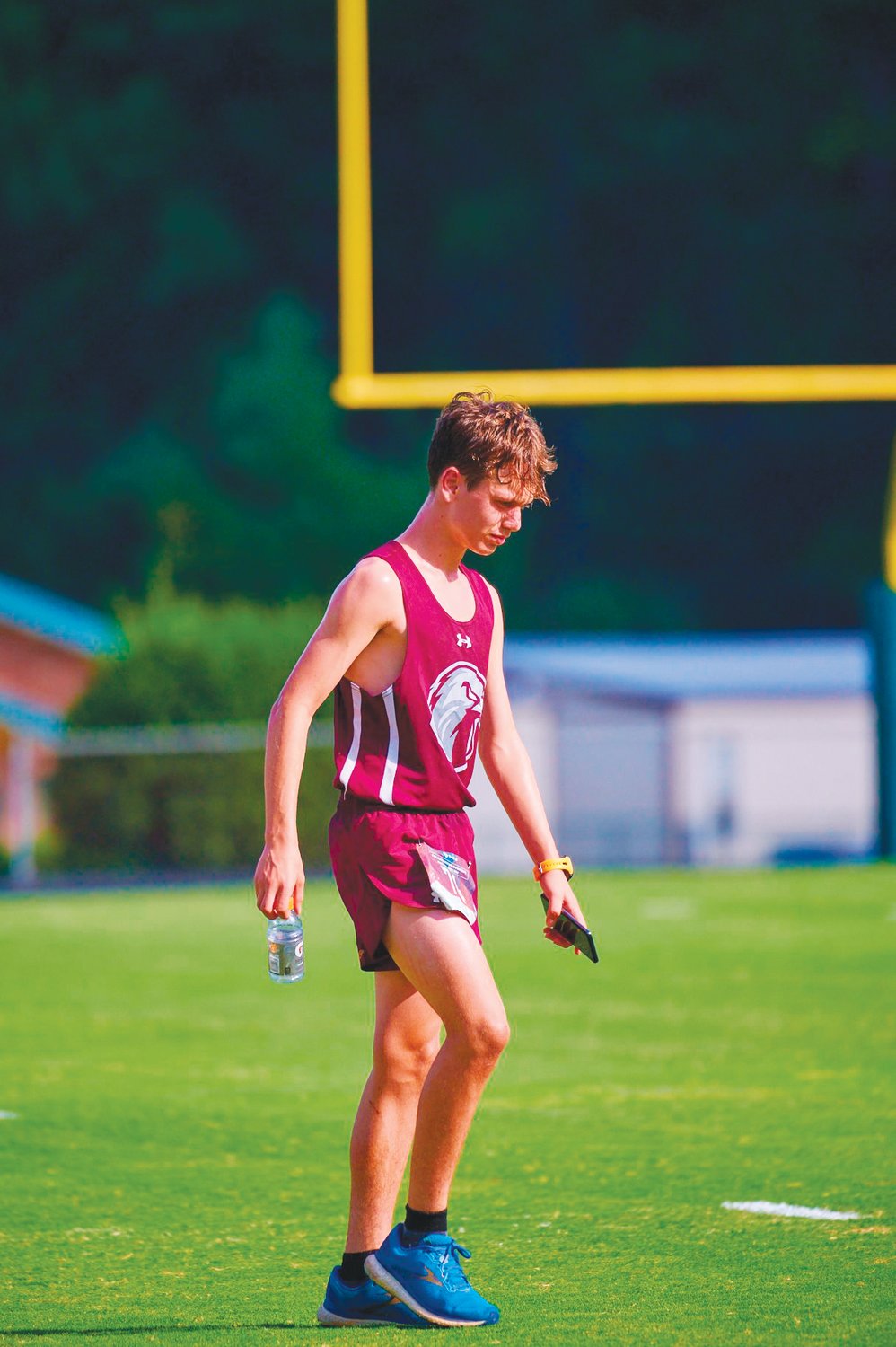 Seaforth freshman Jack Anstrom strolls along the sideline of Northwood's football field after taking first place in the men's race at the Chatham County Championships cross country meet last Thursday in Pittsboro. This was Anstrom's first official race since he was in 7th grade.