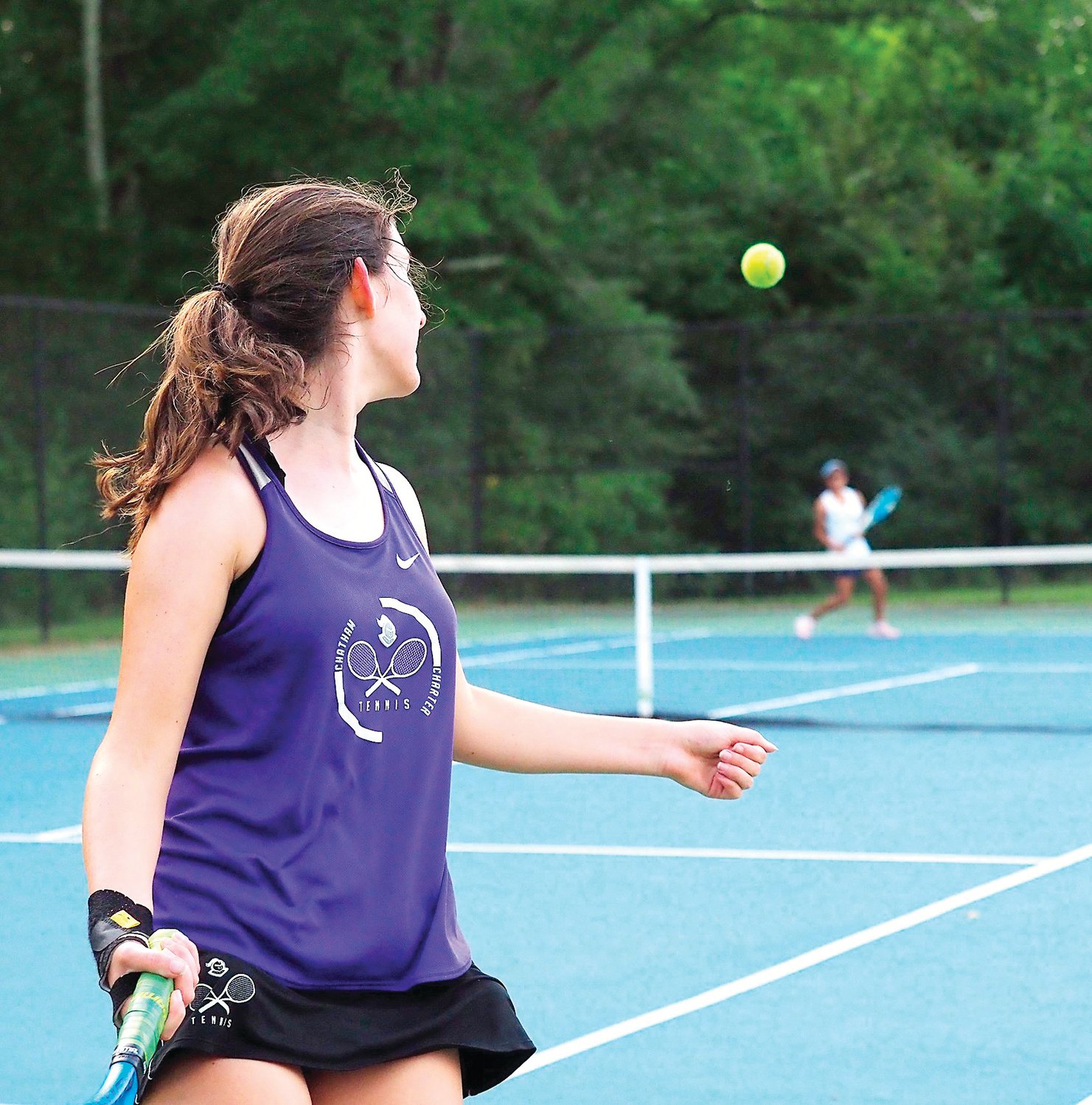 Chatham Charter sophomore Elphie Spillman looks to hit a shot in her singles match against Research Triangle sophomore Olivia Hankinson on Aug. 31. Spillman, who's 1-4 on the season, lost the match, 8-0.