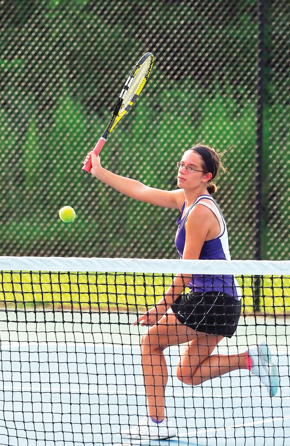 Chatham Charter senior Emily Stecher makes a play at the net during her singles win over Research Triangle junior Julia Shough, 8-2, on Aug. 31. Stecher, the Knights' No. 6 player, was the only member of the team to win both her singles and doubles matches.