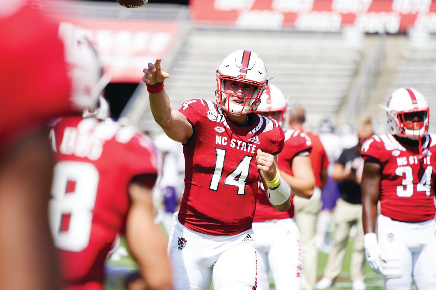 Then-N.C. State quarterback Jamie Shaw (14) warms up ahead of a game against Western Carolina at Carter Finley Stadium on September 7, 2019. Shaw has since switched to middle linebacker.