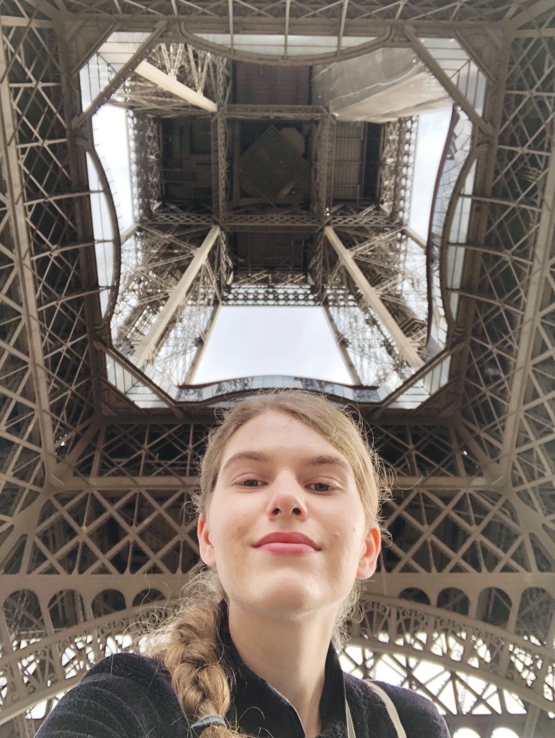 CN+R's Victoria Johnson in May 2019 underneath the Eiffel Tower in Paris, right before she had to take her bag of dirty laundry (the brown strap on her left shoulder) to a dinky laundromat near the tower.