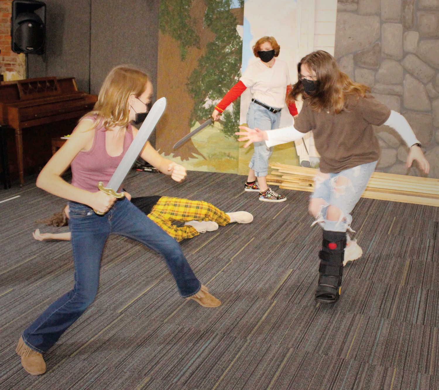 Actors Morgaine Eller, Rylie Ward and Clemantine Janssen rehearse a scene last fall for the Pittsboro Youth Theater production of 'She Kills Monsters.'
