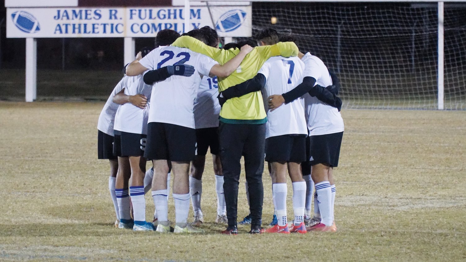 The Jordan-Matthews men's soccer team huddles together just before their fourth-round playoff game against the Greene Central Rams in Snow Hill last Wednesday. The Jets went on to lose the game, 3-1, putting an end to its previously unbeaten season with a 20-1-1 overall record.