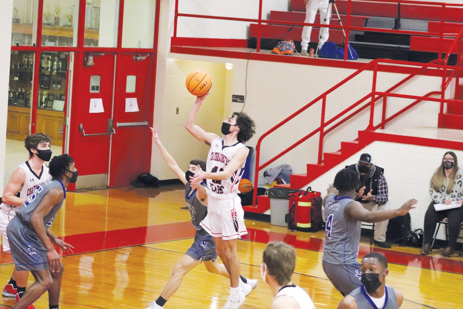 Chatham Central junior guard Colby Williamson (with ball) shoots a floater in his team's 60-59 win over Jordan-Matthews last season. Williamson was one of five players who fouled out in the rivalry game.
