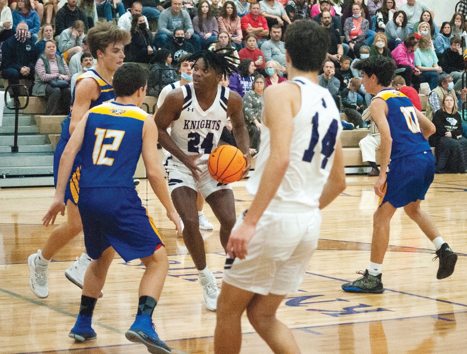 Chatham Charter junior Aamir Mapp (24) looks to drive into the paint in the Knights' 72-58 win over the Faith Christian Eagles on Nov. 16 in Siler City. Mapp was the team's leading scorer on the night with 16 points.
