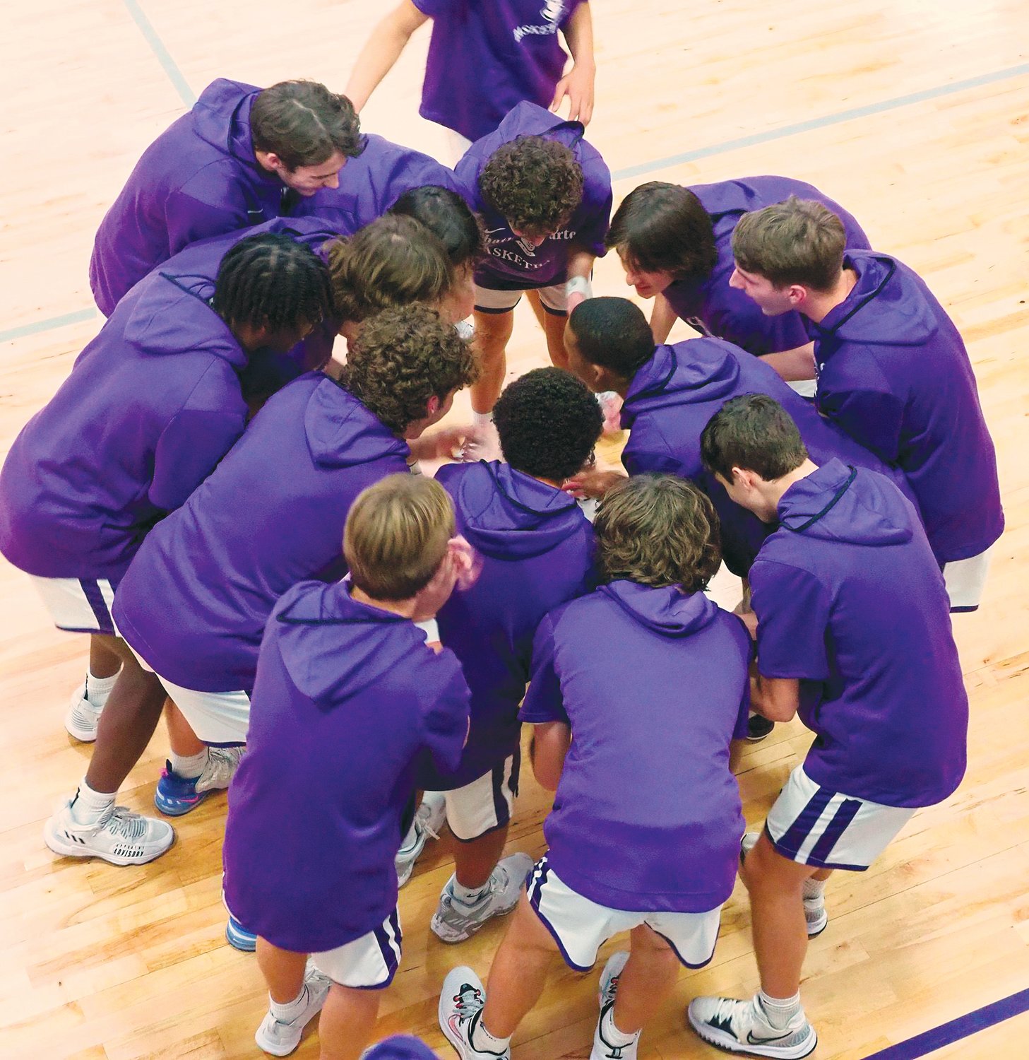 Chatham Charter men's basketball team huddles up before the team's 61-35 win over Chatham Central in Siler City last Friday.