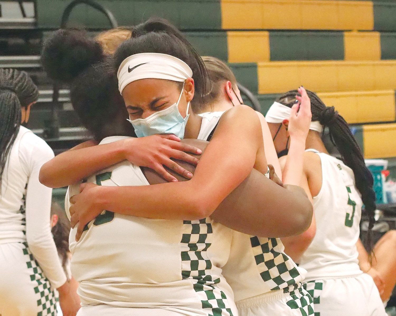 Northwood senior guard Rae McClarty emotionally embraces her teammate and fellow senior Jamaria Faucette (45) after the Chargers' 58-51 first-round playoff win over E.E. Smith, 58-51, on Feb. 23.