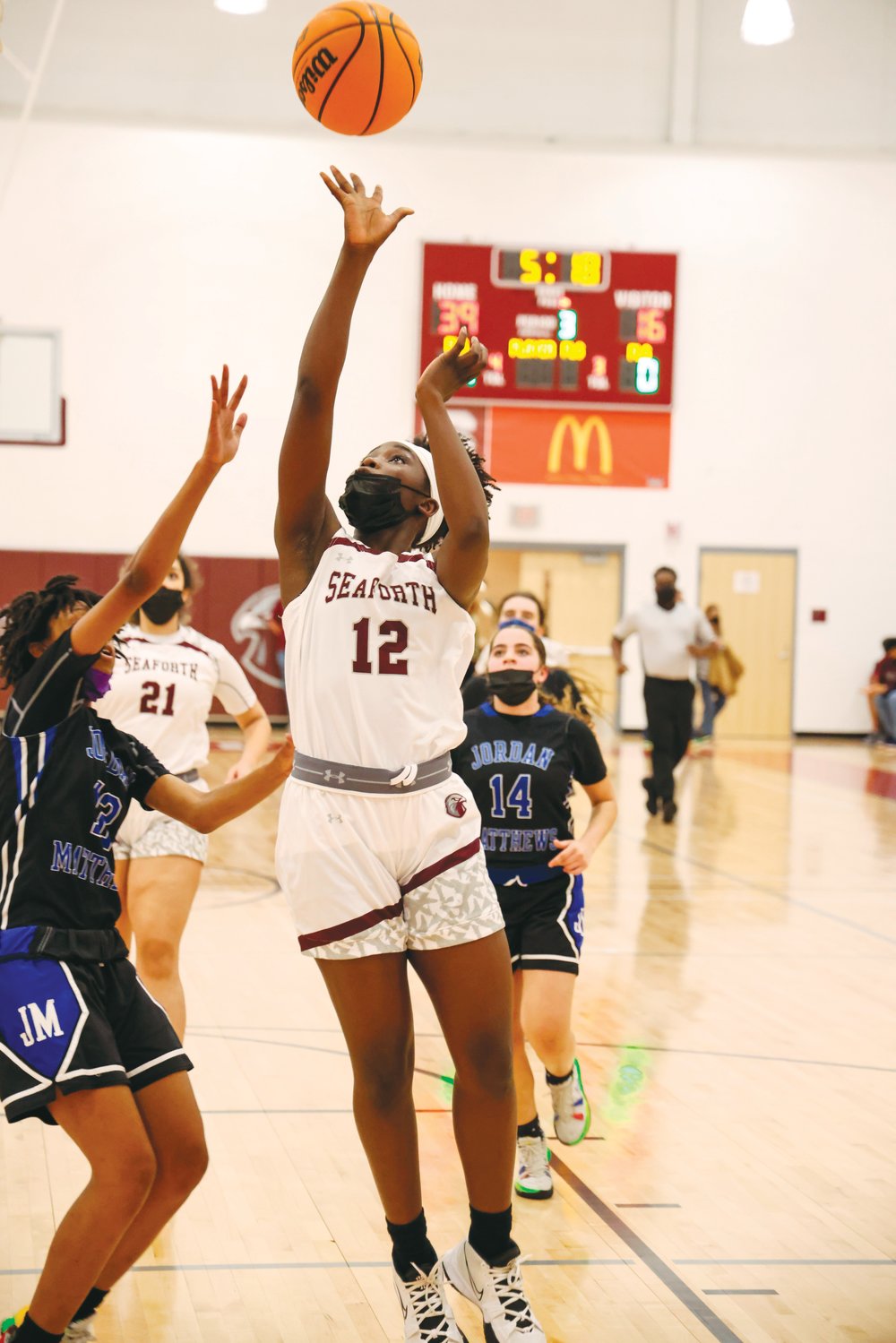 Seaforth sophomore Hannah Ajayi (12) goes up for a layup in the Hawks' 71-28 blowout win over the Jordan-Matthews Jets last Friday in Pittsboro. Ajayi, the team's leading scorer with 20 points, thrived in the team's transition game against J-M.