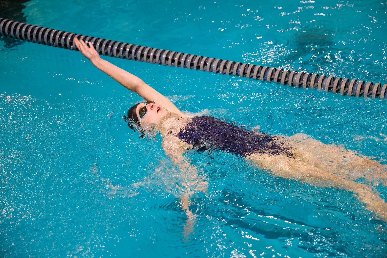 Jordan-Matthews sophomore Sarah Dekaney participates in the women's 100-meter backstroke event at a swim meet in Asheboro last Thursday. She placed 10th in the event with a time of 2:17.01.