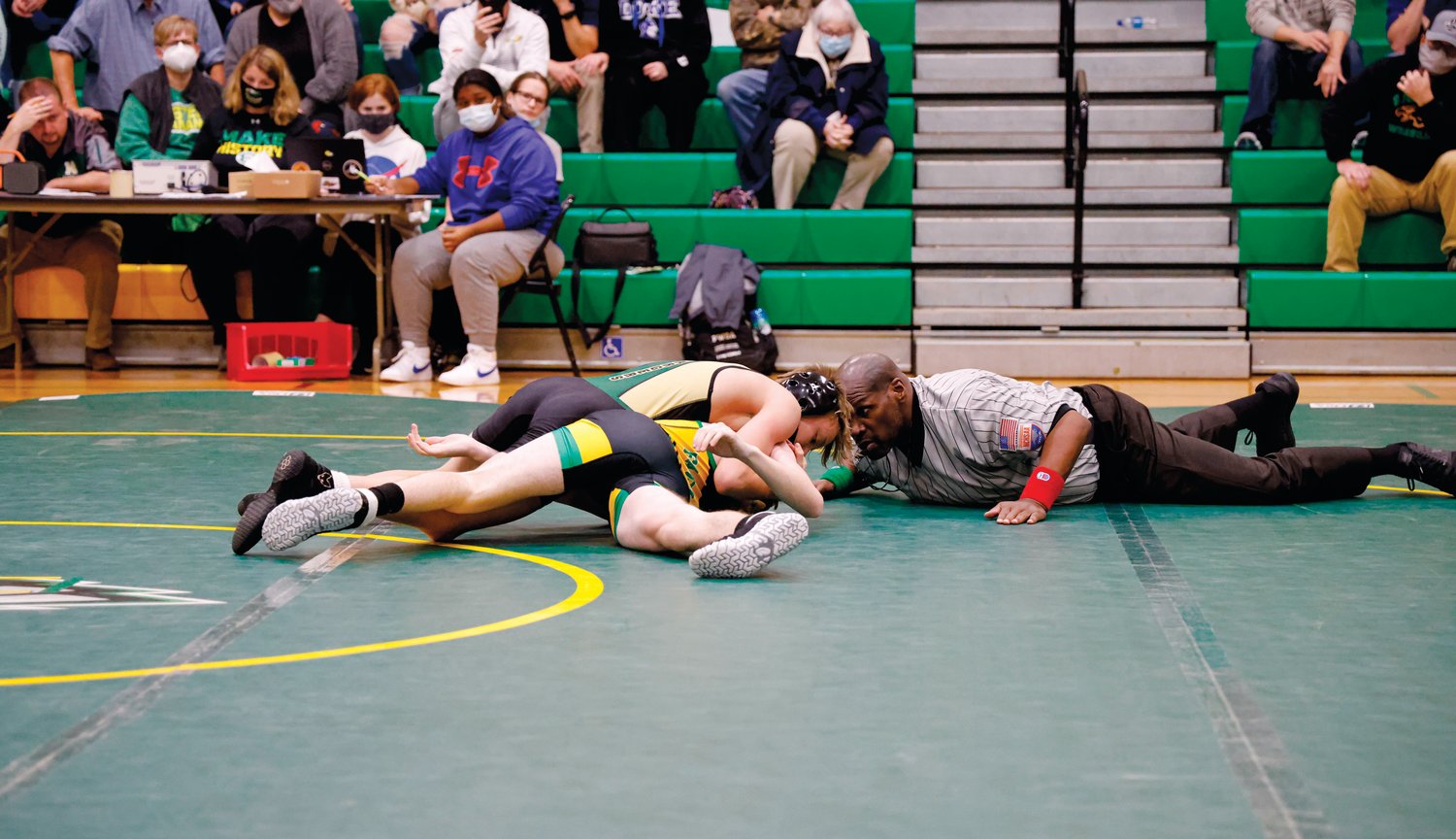 Northwood's Coltrane Northington (top) took advantage of a swift first-period takedown to pin Leo Wise of Eastern Alamance in the first period of their 120-pound bout last Thursday. The Chargers won the come-from-behind match, 42-36.
