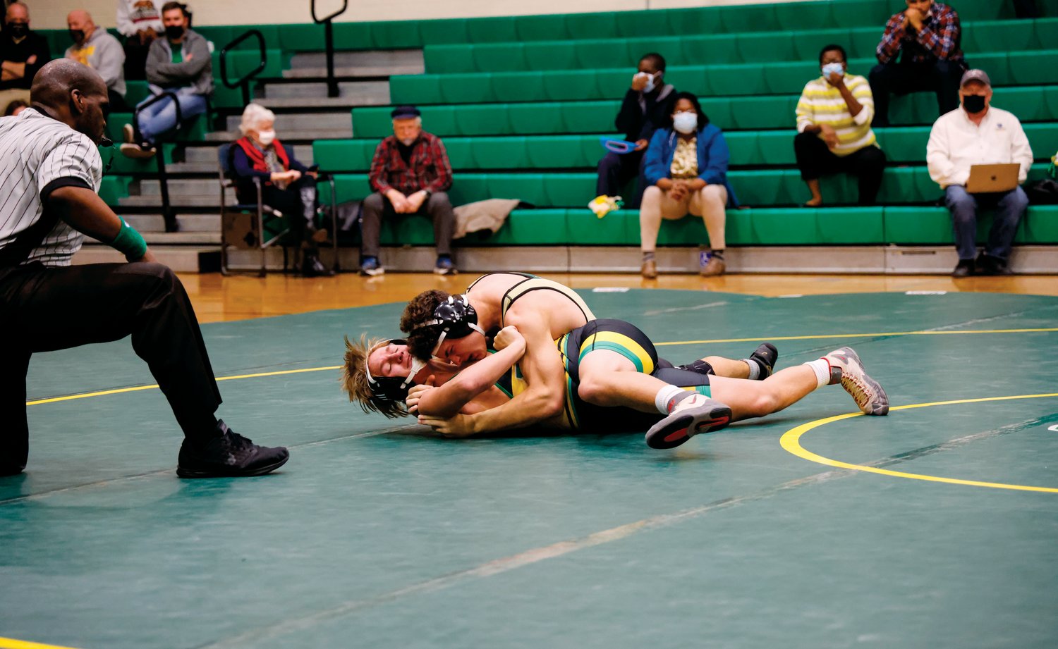 Northwood's Ryan Brinker puts the squeeze on Eastern Alamance's Jackson Fulcher, crunching him with a bear hug to record a fall in just 40 seconds of their 182-pound match during the Chargers' 42-36 win over the Eagles last Thursday.