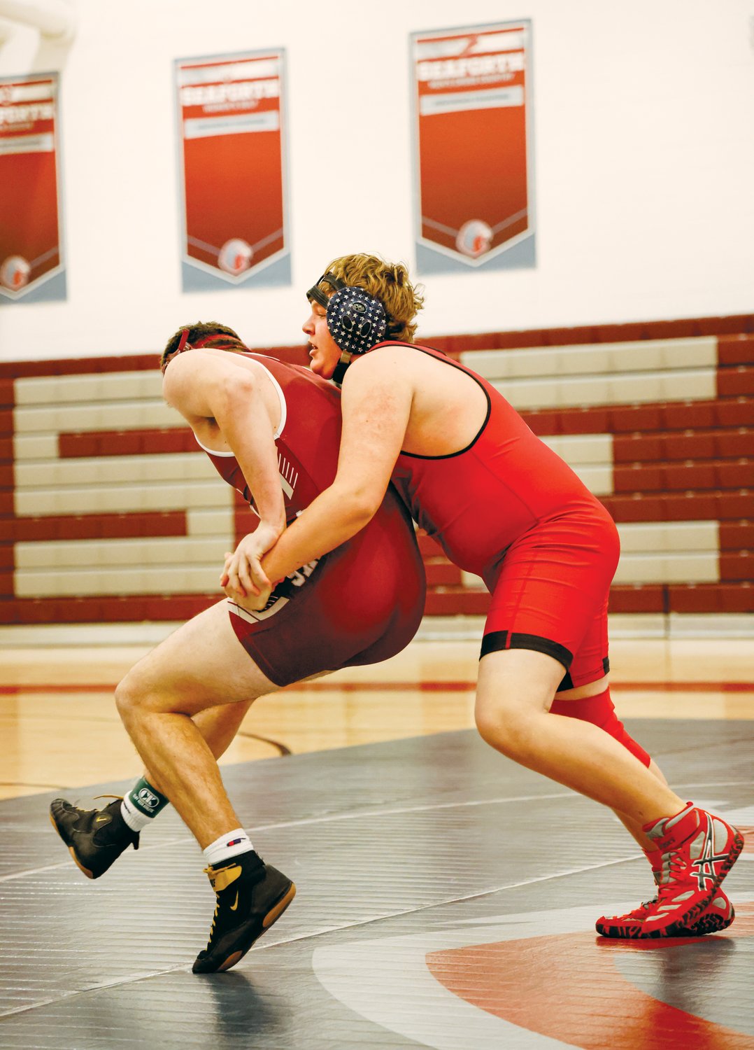 Seaforth's Cole Ballard (left) works to complete a stand-up escape as Chatham Central's Steven Stilhan attempts to maintain control from behind in their 195-pound match last Friday. The Hawks defeated the Bears in their dual-team match, 54-24.