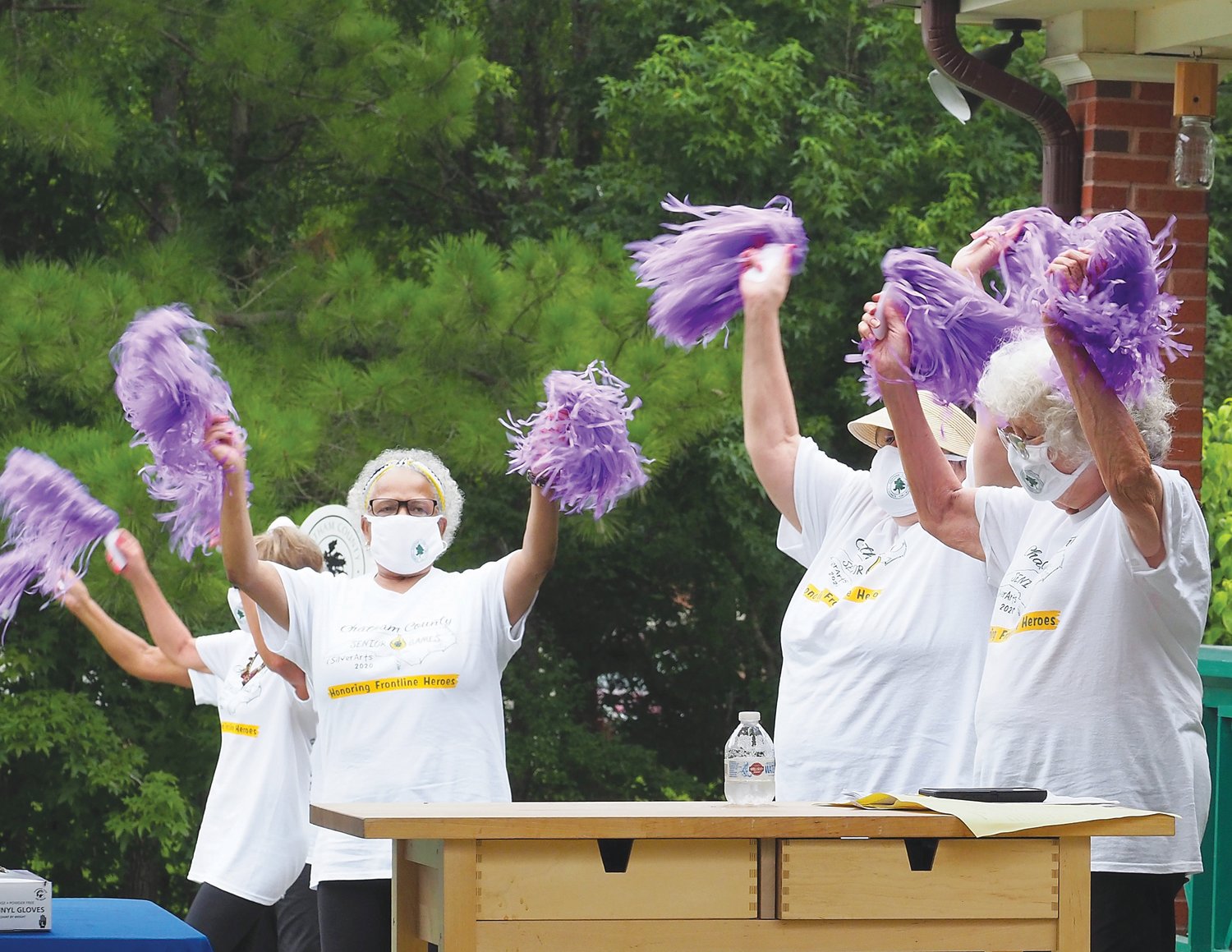 The Chatham Charmers cheer during the 2020 Senior Games' drive-by ceremony.