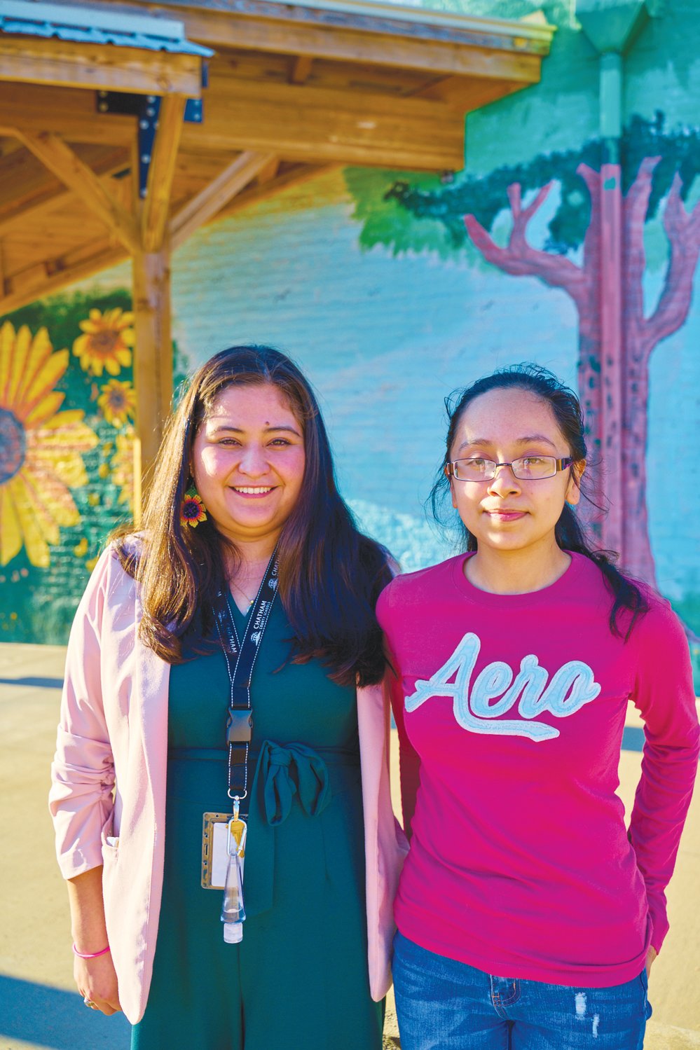 J-M senior Evelin Muñoz Tebalan (right) with the Hispanic Liaison's Selina Lopez, youth program director of Orgullo Latinx Pride. 'I'm also really excited to see where she goes, ‘cause she's just gonna be soaring,' Lopez said of Muñoz Tebalan.