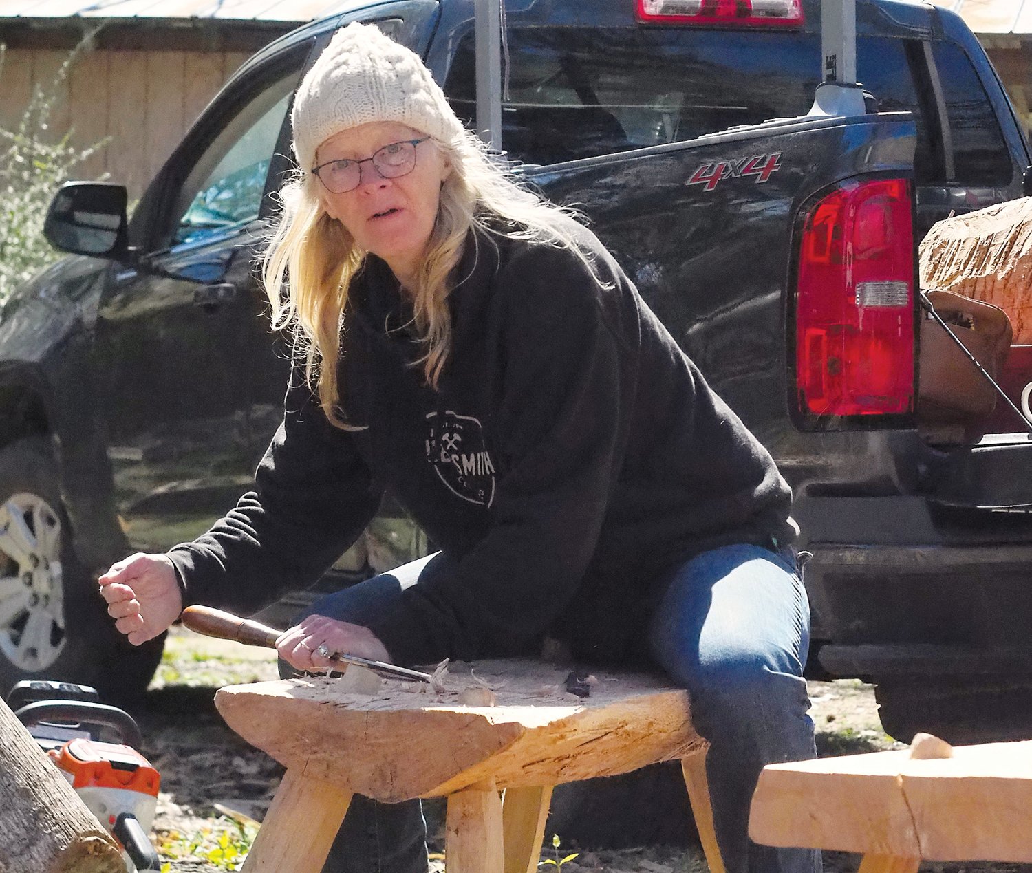 Festival organizer Cara OConnell is shown here practicing the art of woodworking.