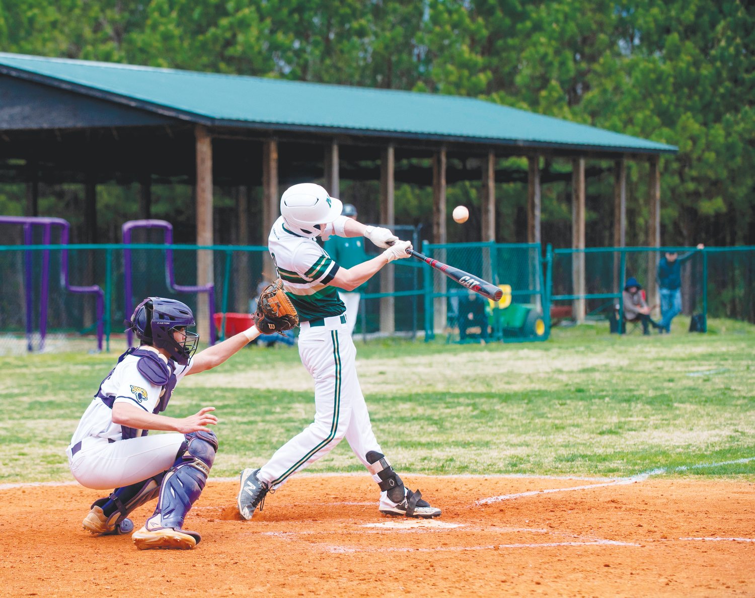 Northwood outfielder Kaleb Howell hits a pitch during the Chargers' 7-3 win over the Carrboro Jaguars last Saturday. Howell was one of seven Chargers with a hit on the day.