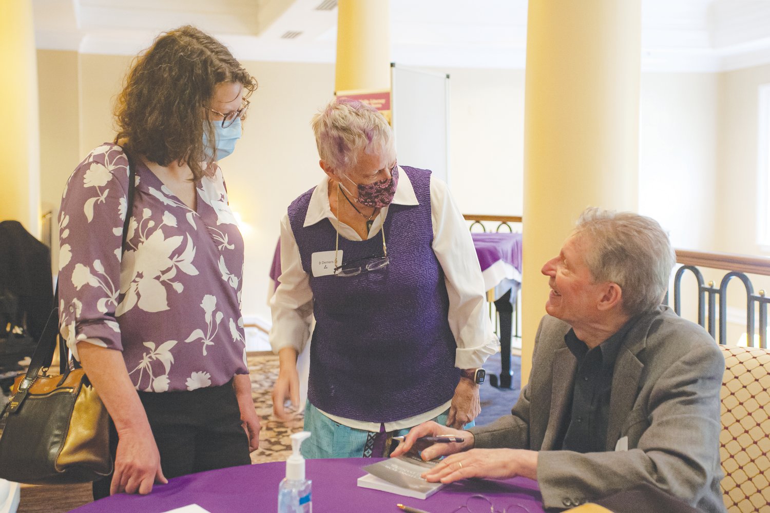 John Rosenthal chats with two attendees of Chatham Literacy's spring fundraiser. Rosenthal, a celebrated photographer, recently published 'Searching for Amylu Danzer,' a critically-acclaimed memoir.