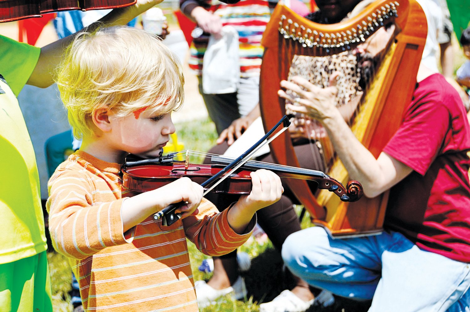 A child tries out a stringed instrument at ClydeFEST's High Strung Instrument Petting Zoo. Named after Bynum folk art legend Clyde Jones, the Chatham Arts Council’s ClydeFEST is a family-friendly day of hands-on arts immersion for children of all ages.