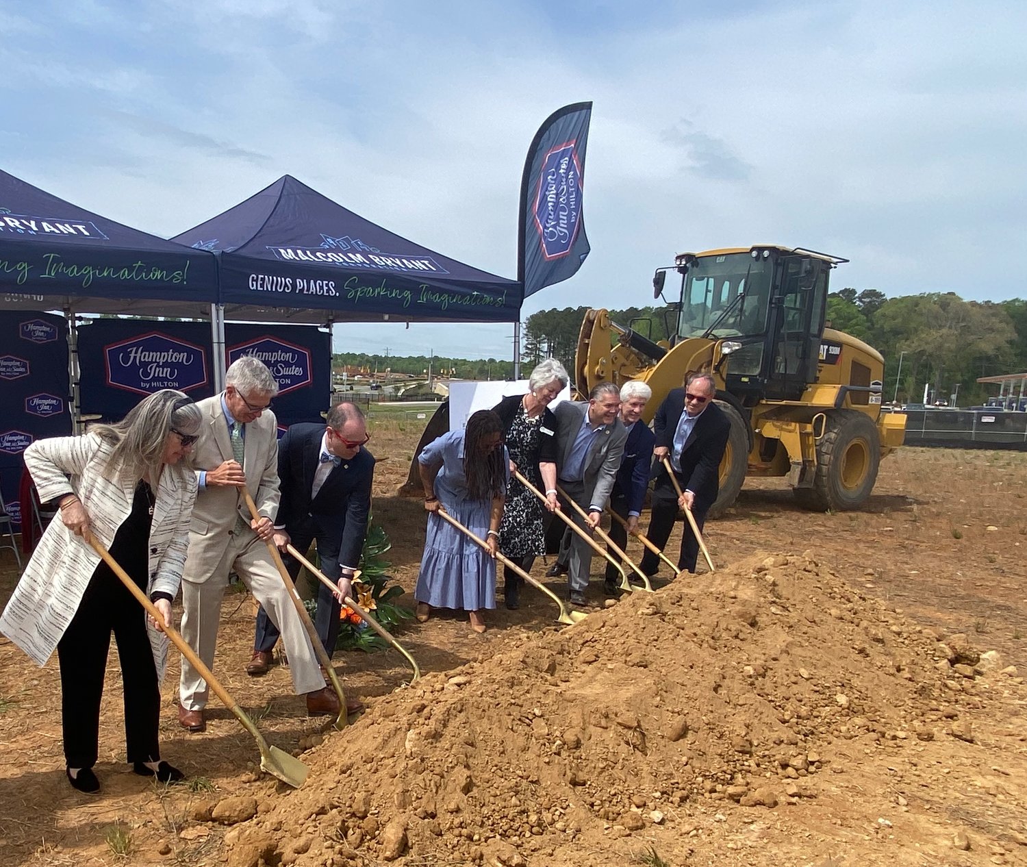 Project developers and local officials 'turn the dirt' at Thursday's groundbreaking ceremony.