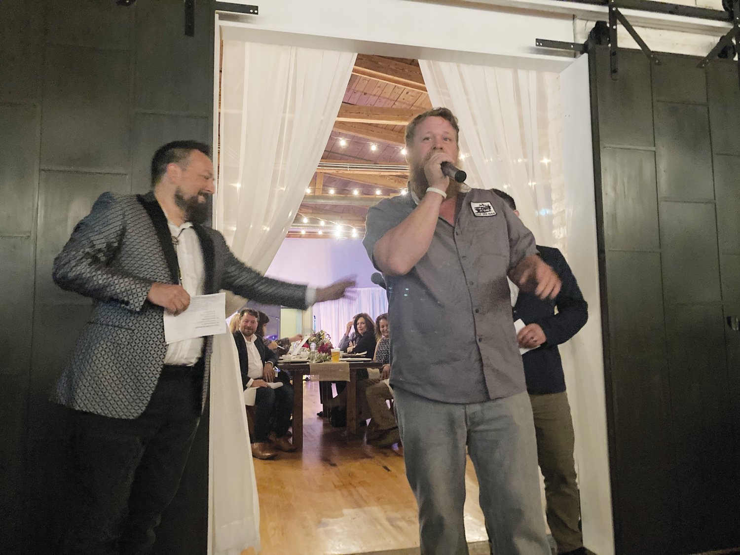 Tucker Withington (right) was the live auctioneer at Sunday's 'Local on Lorax' event