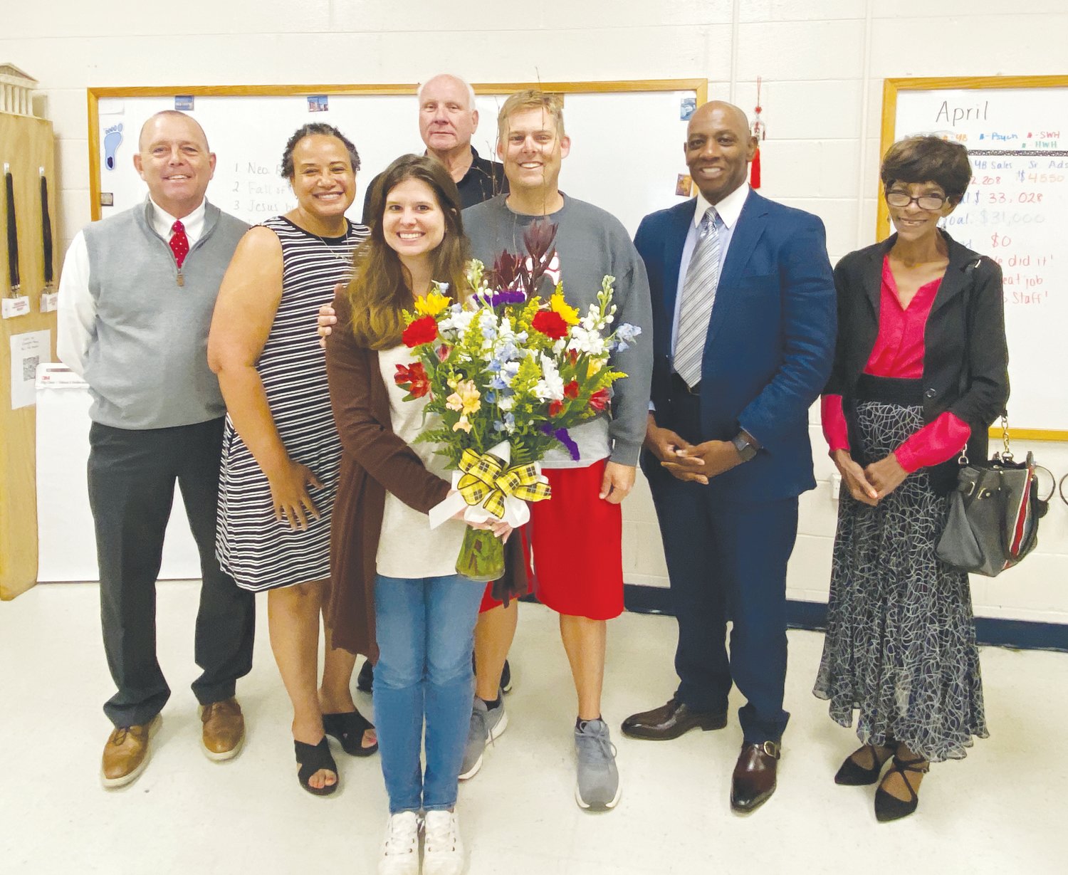 Chatham County school board Chairperson Gary Leonard (from left), Chatham Central High School Principal Karla Eanes, Teacher of the Year Cassadi Walden, school board member David Hamm, Chatham Central High School teacher Brett Walden, Superintendent Anthony Jackson, and school board member Del Turner.