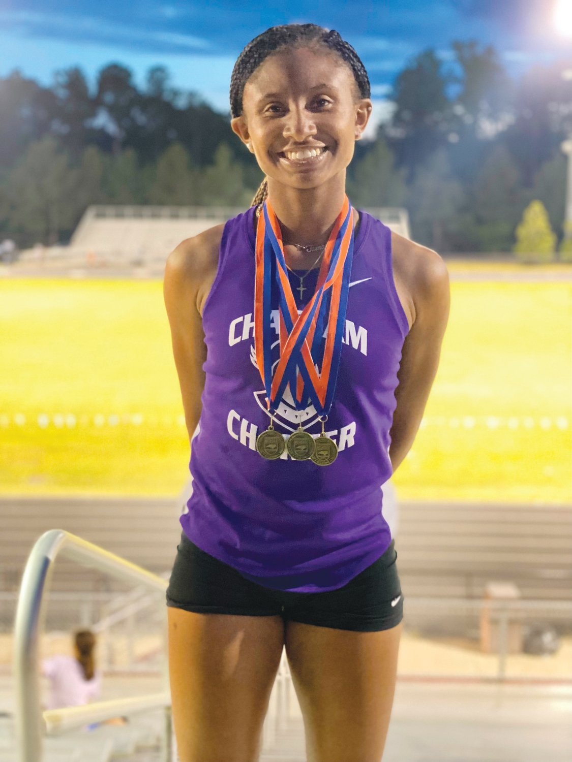 Chatham Charter junior Tamaya Walden poses with her three gold medals following her performance at the NCHSAA 1A Mideast Regionals at Franklinton High School on Saturday. Walden took first place in the women's 100-, 200- and 400-meter dashes, qualifying for states in all three events.