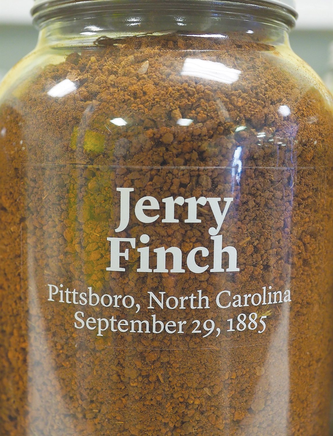 Soil from Jerry Finch's lynching site filled two identical jars. One will remain in Chatham County, while the other will be displayed at EJI's Legacy Museum in Montgomery, Alabama.
