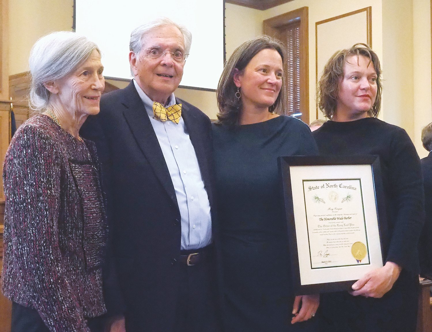Wade Barber, shown here with family members after receiving the Order of the Long Leaf Pine in March, died Friday at the age of 78.